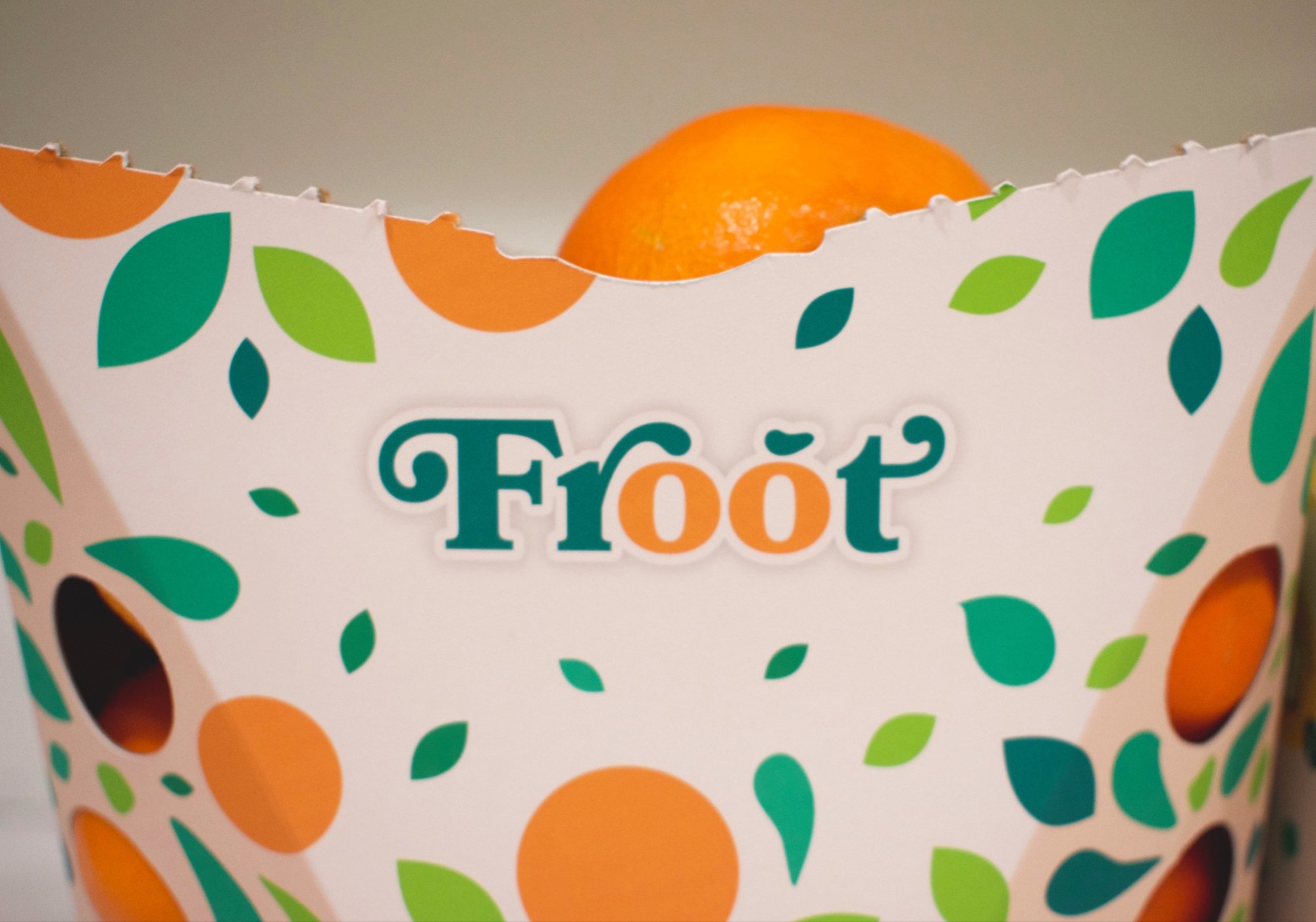 Close-up of the mandarin bowl and the Froot wordmark