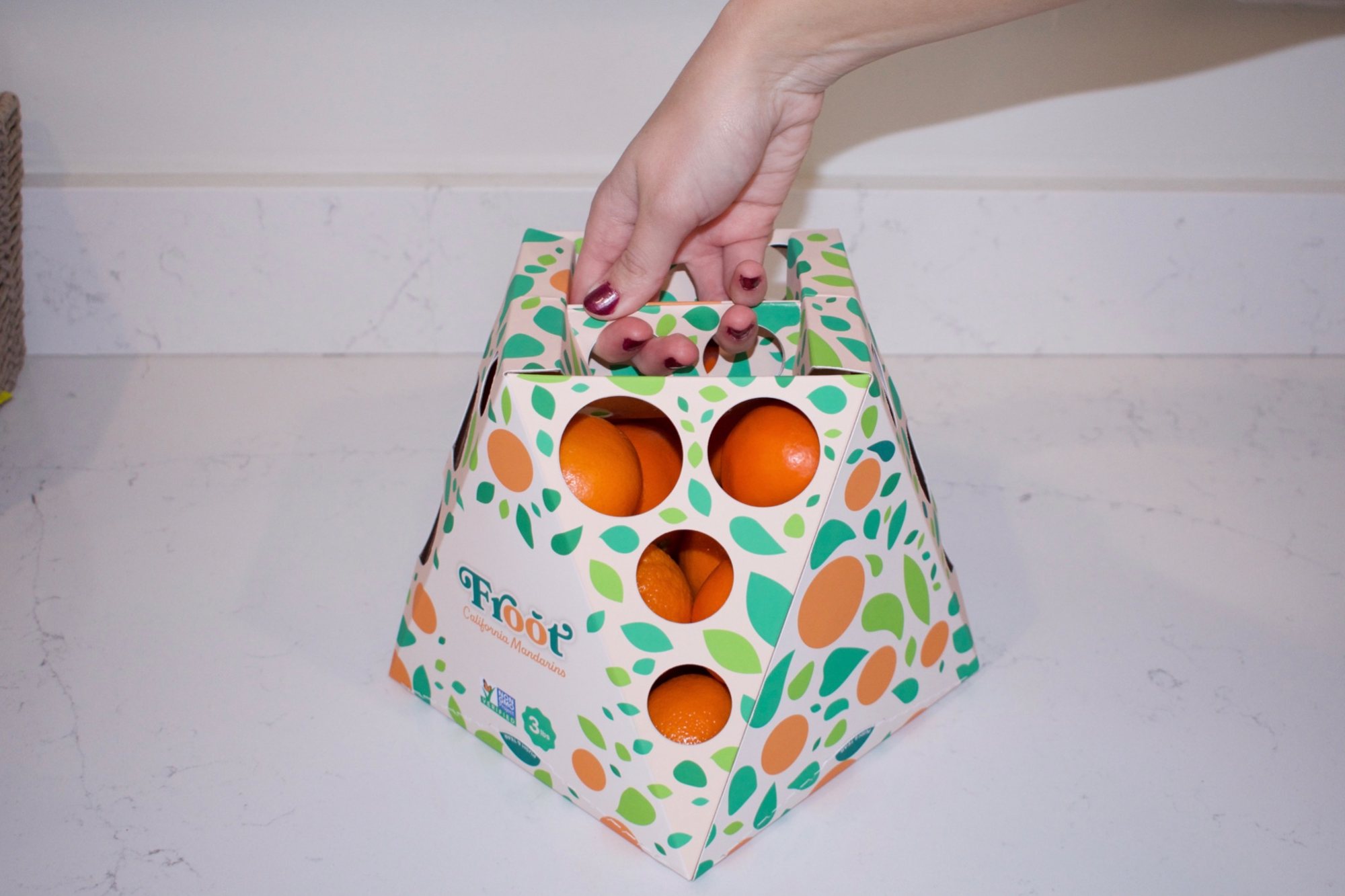 The mandarin carton carried by its recessed handle